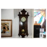 Gustav Becker Vienna Wall Clock, cream dial with Roman numerals, twin weights, overall height 49".