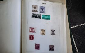 Small Green Springback Album with many useful early British Commonwealth postage stamps.