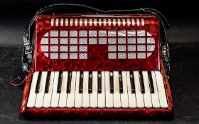 Piano Accordion by Chanson, red, in fitted carrying bag.