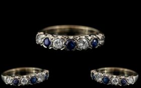 Ladies - 18ct White Gold 7 Stone Diamond and Sapphire Set Ring. Full hallmark to Interior of Shank.