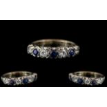 Ladies - 18ct White Gold 7 Stone Diamond and Sapphire Set Ring. Full hallmark to Interior of Shank.