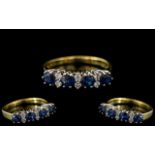 18ct Gold - Attractive Contemporary Designed Diamond and Sapphire Set Dress Ring.