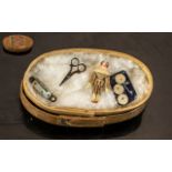 A Miniature Wooden Sewing Box, complete with miniature, penknife, scissors, jointed figure,