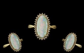 18ct Gold Attractive Opal and Diamond Set Dress Ring full hallmark for 750 to interior of shank.