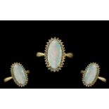 18ct Gold Attractive Opal and Diamond Set Dress Ring full hallmark for 750 to interior of shank.