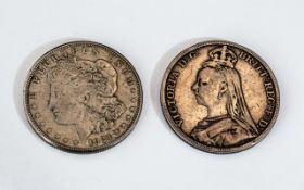 A 1921 Peace Dollar and 1892 Victorian Crown both in worn condition.
