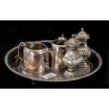 Small Collection of Silver Plated Ware, comprising a cruet set, a salt pot with blue glass liner,