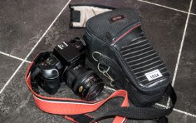 A Canon Eos 750 Camera, in carry case.