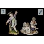 Two Continental Porcelain Figures, a 19th Century German figure group of two putti,