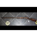 A 19th Century Percussion Riffle walnut stock steel trigger guard and 39 1/4 inch barrel,