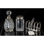 Small Silver Toast Rack, hallmarked for Sheffield U 1937, together with two cut glass table jars,