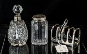 Small Silver Toast Rack, hallmarked for Sheffield U 1937, together with two cut glass table jars,