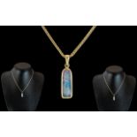 18ct Gold - Black Opal Set Pendant with Attached 18ct Gold Chain.