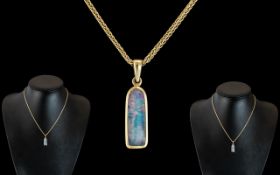18ct Gold - Black Opal Set Pendant with Attached 18ct Gold Chain.