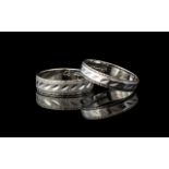 A Pair of 18ct White Gold Wedding Bands fully hallmarked gross weight 9 grams