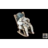 Lladro Figure No. 5.448, 'Naptime', depicting a sleepy little girl in a chair.