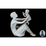 Kaiser Porcelain Bisque figure 'Mother & Child'. Height 8.5". Marked to base 398, Kaiser, Germany.