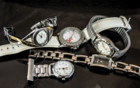 Collection of Ladies Fashion Watches, comprising DKNY bracelet watch in gold and silver tone,