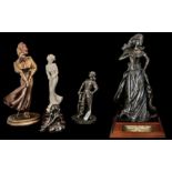 Collection of Bronzed and Porcelain Figures, comprising a 14'' figure of a lady golfer in