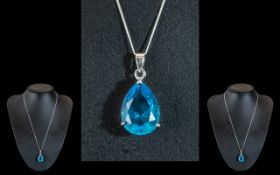 A Pear Shaped Large Blue Topaz Pendant Set in Silver.