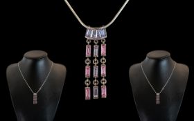 Attractive Sterling Silver Ladies Necklace contemporary piece with pink topaz set pendant and drops.