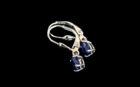 Sapphire Drop Earrings, oval cut solitaire sapphires totalling 1.