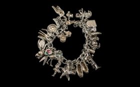 Vintage Sterling Silver Charm Bracelet - Loaded with 28 Silver Charms of Good Quality.