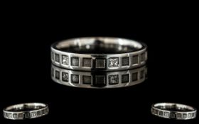 A Platinum Diamond Set Wedding/Eternity Ring, set with six princess cut diamonds, fully hallmarked.