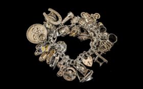 Excellent Vintage Sterling Silver Charm Bracelet Loaded with 27 Silver Charms of Good Quality All