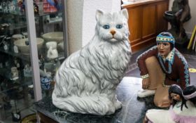 An Italian Fireside Figure of a Seated Cat realistically modelled.