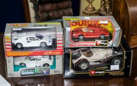 Collection of Four Boxed Die Cast Models, including Burago Mercedes Benz 5SK 1928,