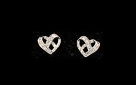 Diamond Set Heart Stud Earrings, a pair of openwork hearts in the style of curving ribbon,