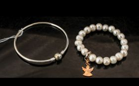 A Pandora Jewellery Silver Bangle in fitted box together with a Thomas Sabo charm club bracelet in