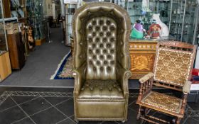 An early 20thC Green Leather Chesterfield Style Porters Chair button backed seat and back rest and