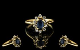 Ladies 9ct Gold Sapphire & Diamond Dress Ring, oval sapphire surrounded by small diamonds in a