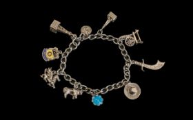 Excellent Sterling Silver Charm Bracelet Loaded with (10) Charms comprising Persian dagger,