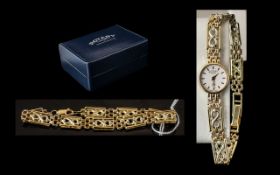 A Ladies 9ct Gold Rotary Wristwatch with matching bracelet.