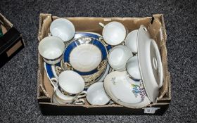 Two Porcelain Tea Sets, comprising Staffordshire New Chelsea 'Alicia' set of six cups,