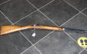 A 19th/20th Century Percussion Riffle, steel barrel and trigger guard, brass mounts.