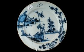 A 18th/19th Century Chinese Decorated Tin Glazed Charger, depicting a figure in landscape,