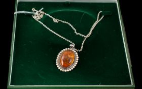 Amber & Silver Pendant, suspended on a fancy silver 24'' chain, pendant size with bale 55 ml.