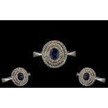 14ct White Gold - Ladies Attractive Blue Sapphire and Diamond Set Ring of Circular Form. Marked