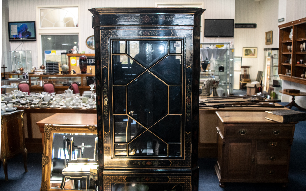 A Chinoiserie Decorated black lacquered corner unit with gilt highlights and landscape decoration. - Image 3 of 3