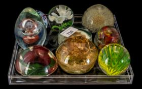 A Collection of Nine Paperweights made i