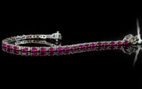 Ruby Tennis Bracelet, 11cts of oval cut