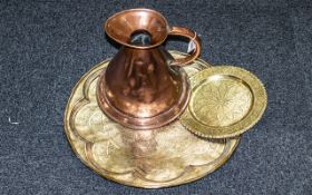 Victorian Copper Milk Jug, measures height 10'', together with a Middle Eastern engraved brass