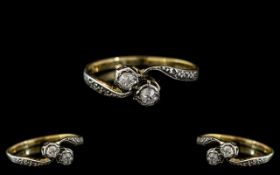18ct Gold and Platinum Two Stone Diamond Twist Ring with diamond shoulders,