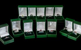 Collection of Twelve Silver Dress Rings, set with coloured crystals, stones, pearls, etc.