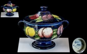 William Moorcroft Superb Twin Handled Lidded Footed Bowl, 'Wisteria' design on blue ground, c1925,
