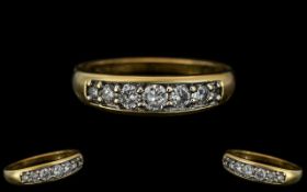 18ct Yellow Gold - Superior Quality and Attractive Seven Stone Diamond Set Dress Ring. Marked 750 to